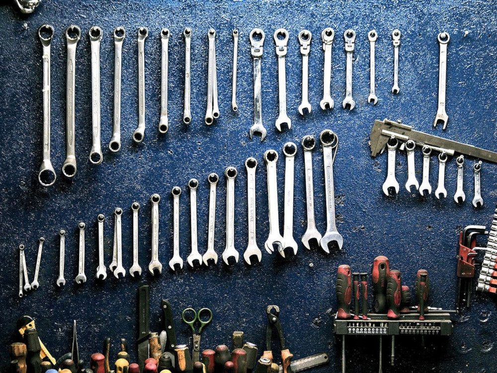 Image of Wrenches hanging on blue wall for Skaha Marina mechanical Services