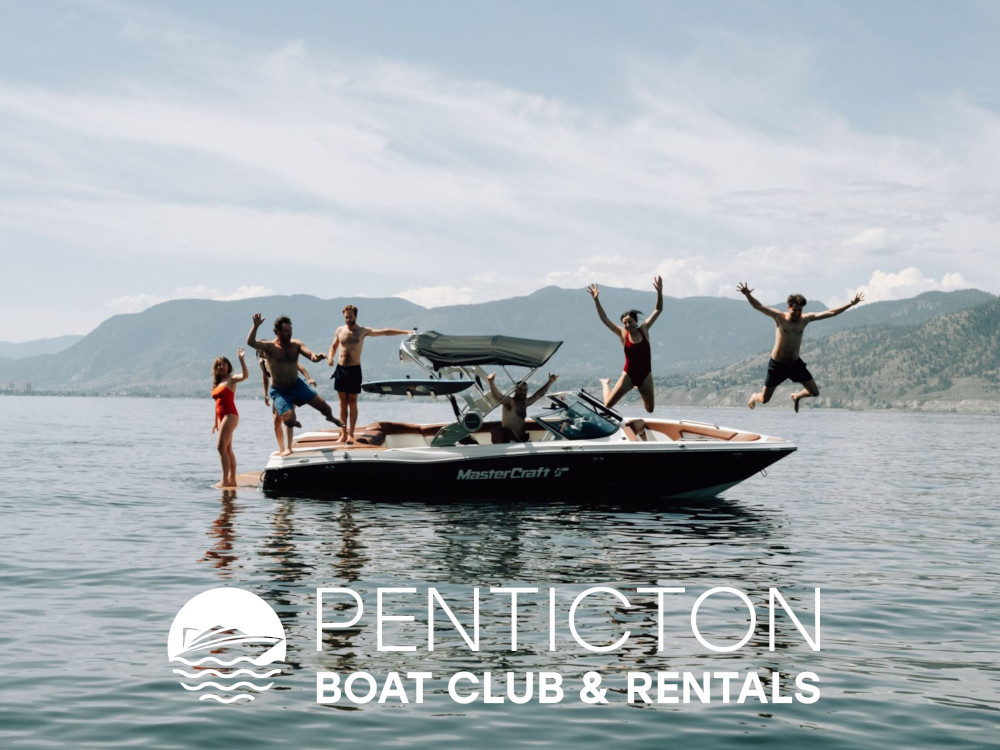 People jumping off boat rented from Penticton Boat Club and Rentals